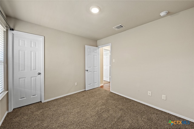 unfurnished bedroom featuring carpet