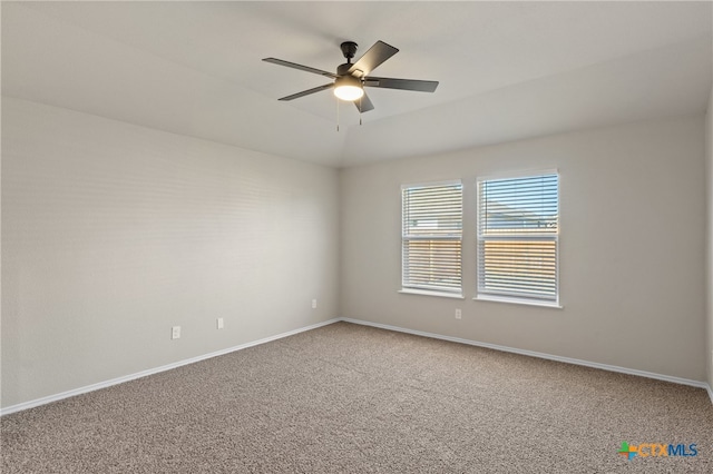 spare room with carpet flooring and ceiling fan