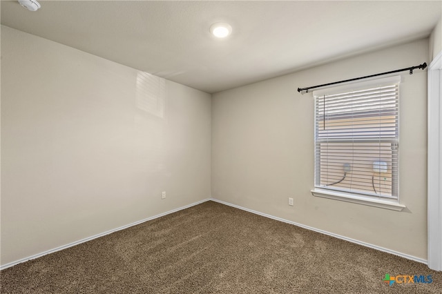 spare room featuring carpet flooring