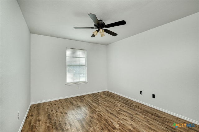 unfurnished room with ceiling fan and wood-type flooring