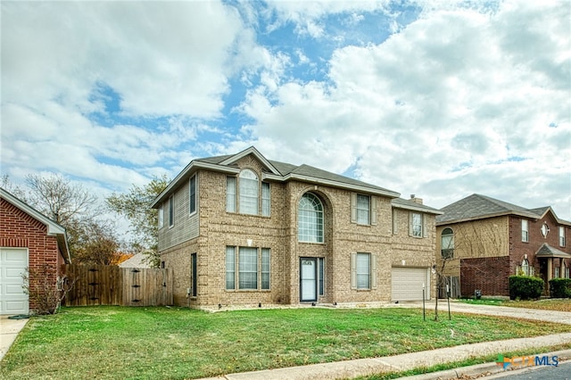 view of front of property with a garage and a front yard