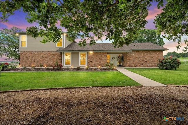 view of front of house with a lawn