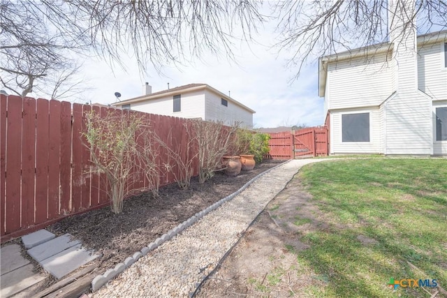 view of yard featuring a fenced backyard