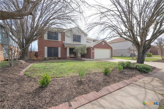 traditional home with brick siding, an attached garage, concrete driveway, and a front yard