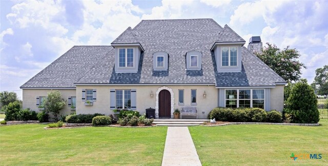 view of front of house with a yard