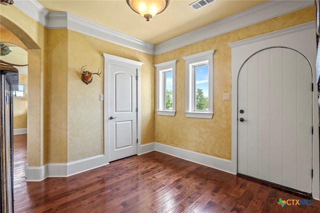 entrance foyer featuring dark hardwood / wood-style floors and ornamental molding