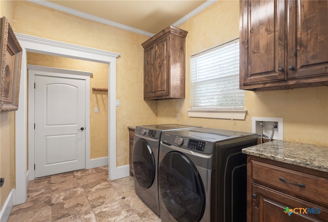 laundry room with cabinets, independent washer and dryer, and ornamental molding