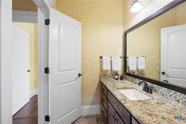 bathroom featuring hardwood / wood-style floors and vanity