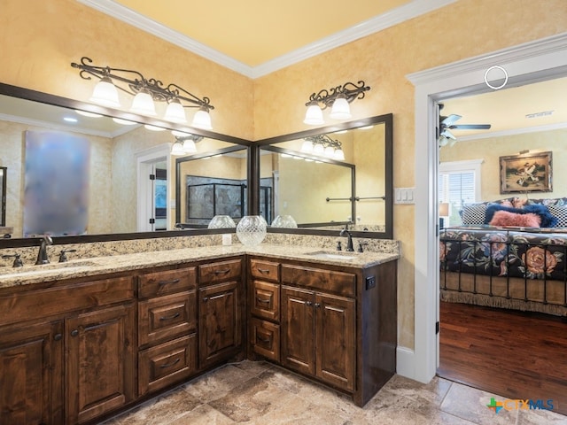 bathroom with ceiling fan, hardwood / wood-style floors, vanity, and ornamental molding