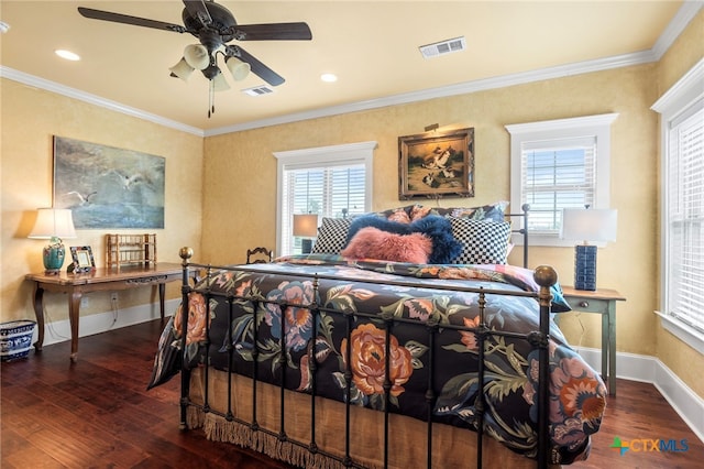 bedroom with dark hardwood / wood-style floors, ceiling fan, and crown molding