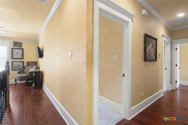 corridor featuring dark hardwood / wood-style floors and crown molding