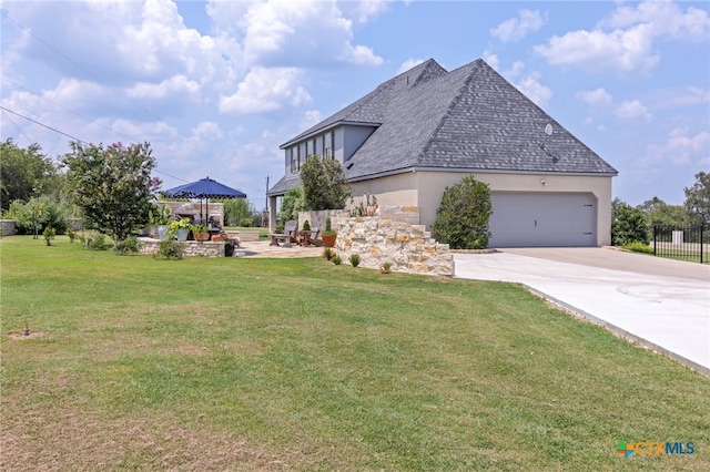 view of property exterior featuring a yard and a garage