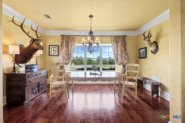 sitting room featuring an inviting chandelier, dark wood-type flooring, and ornamental molding