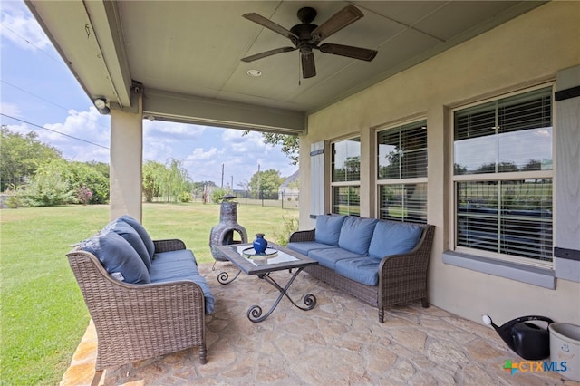 view of patio with outdoor lounge area and ceiling fan