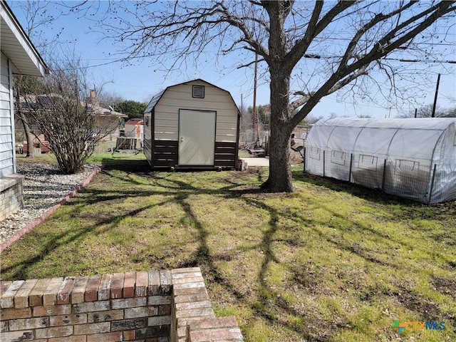 view of yard featuring an outbuilding and a storage unit