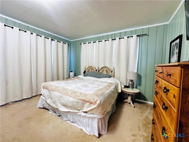 bedroom with light colored carpet and crown molding