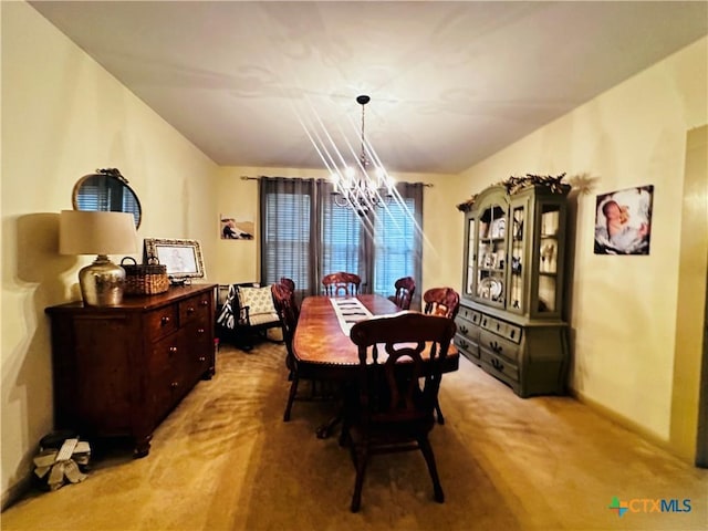 205 Coke St, Yoakum, TX 77995 - carpeted dining space with a chandelier