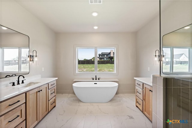 227 Glenview Cir, Belton, TX 76513 - full bath featuring vanity, plenty of natural light, a soaking tub, and recessed lighting