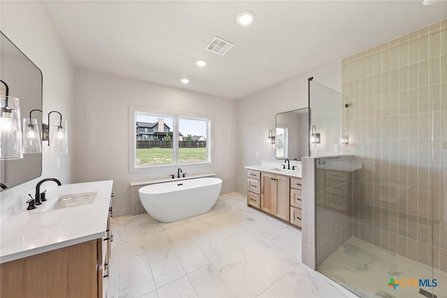 227 Glenview Cir, Belton, TX 76513 - full bathroom featuring marble finish floors, two vanities, a shower stall, a soaking tub, and recessed lighting