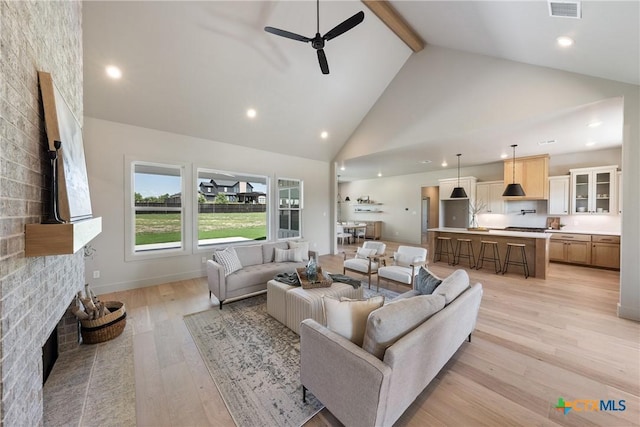 227 Glenview Cir, Belton, TX 76513 - living area with high vaulted ceiling, a ceiling fan, light wood finished floors, beam ceiling, and baseboards