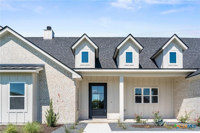 227 Glenview Cir, Belton, TX 76513 - doorway to property featuring board and batten siding, a chimney, and roof with shingles