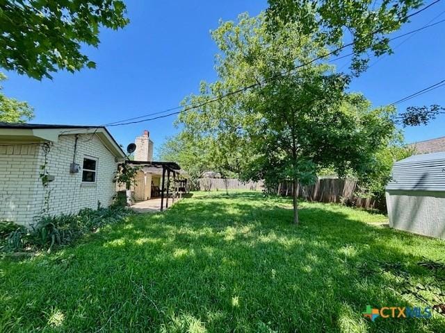 119 Gateway Cir, Gatesville, TX 76528 - view of yard featuring a patio area and a fenced backyard