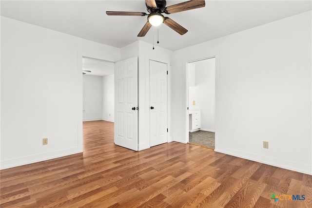 unfurnished bedroom featuring light wood-style floors, ceiling fan, and baseboards