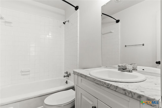 full bath with toilet, shower / washtub combination, and vanity