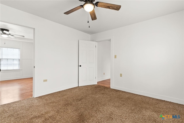 unfurnished bedroom with carpet floors, ceiling fan, and baseboards