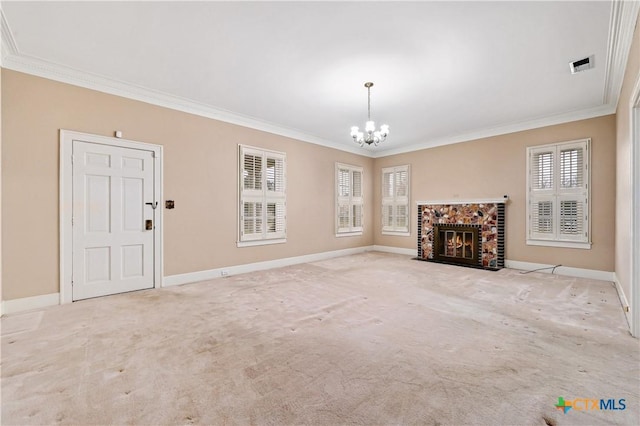 unfurnished living room with crown molding, visible vents, a notable chandelier, and a fireplace with flush hearth