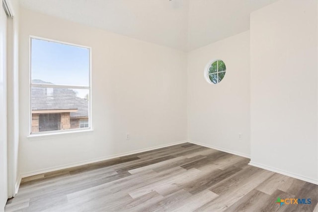 unfurnished room featuring light hardwood / wood-style floors