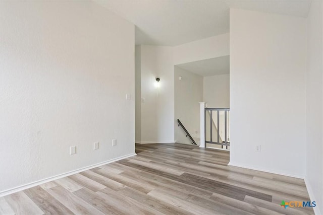 unfurnished room with light hardwood / wood-style flooring