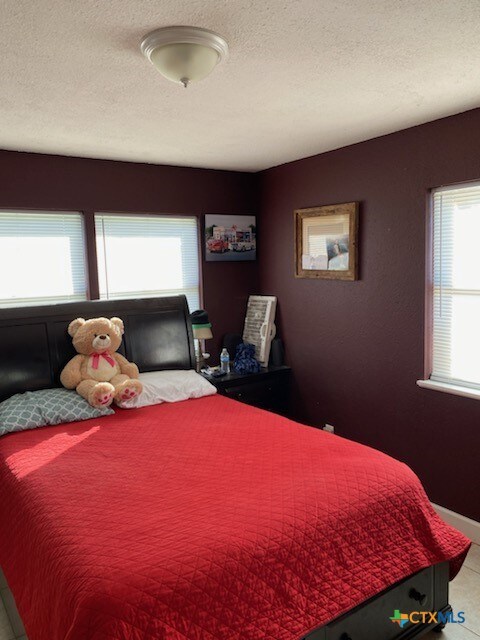 bedroom with a textured ceiling