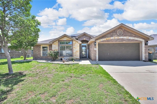 6704 Deorsam Loop, Killeen, TX 76542 - ranch-style house featuring a garage, brick siding, driveway, and a front yard