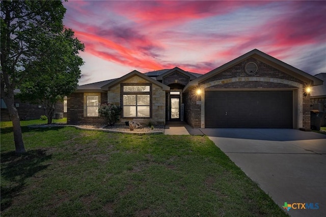 6704 Deorsam Loop, Killeen, TX 76542 - single story home featuring an attached garage, concrete driveway, a lawn, and brick siding