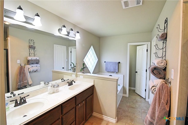 6704 Deorsam Loop, Killeen, TX 76542 - full bathroom featuring double vanity and a bath