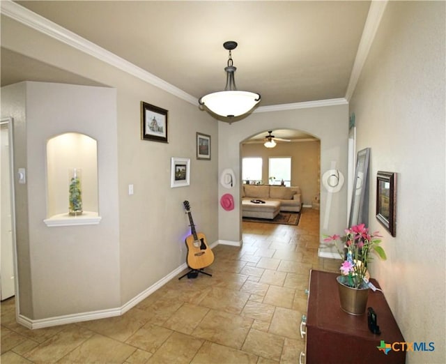 6704 Deorsam Loop, Killeen, TX 76542 - hall featuring arched walkways, stone tile flooring, ornamental molding, and baseboards