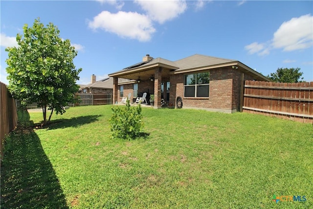 6704 Deorsam Loop, Killeen, TX 76542 - back of house with ceiling fan, brick siding, a chimney, and a patio area