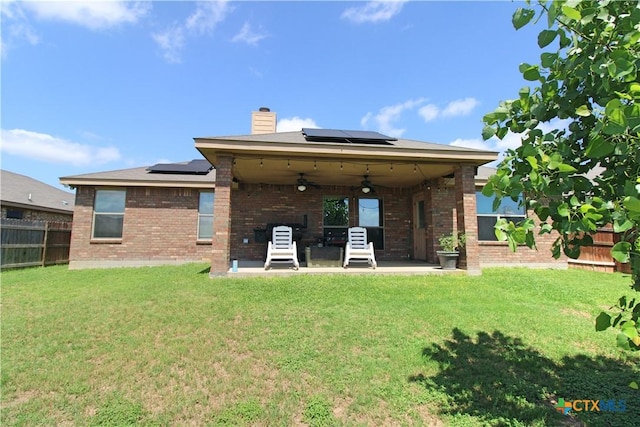 6704 Deorsam Loop, Killeen, TX 76542 - rear view of house with ceiling fan, a patio, brick siding, and a chimney