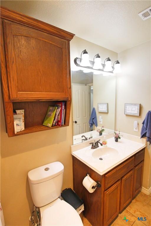 6704 Deorsam Loop, Killeen, TX 76542 - bathroom featuring vanity and toilet