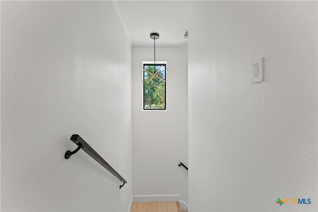 staircase featuring hardwood / wood-style floors