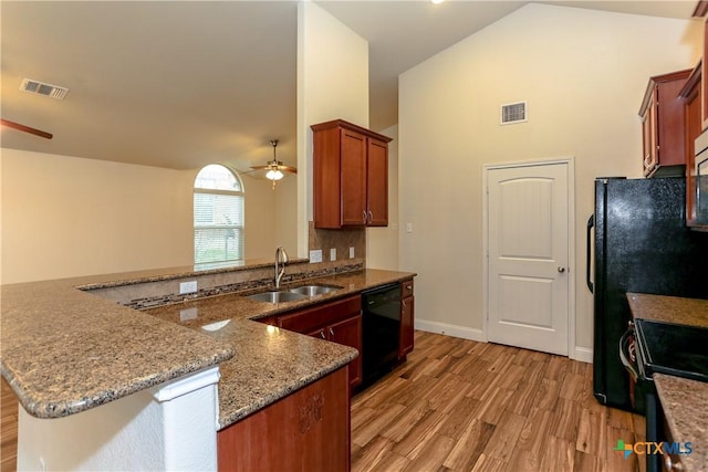 kitchen featuring kitchen peninsula, ceiling fan, sink, and black appliances