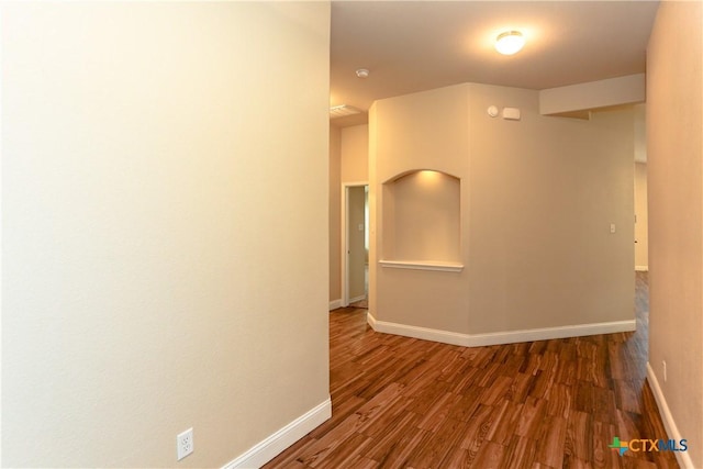 corridor featuring dark hardwood / wood-style flooring