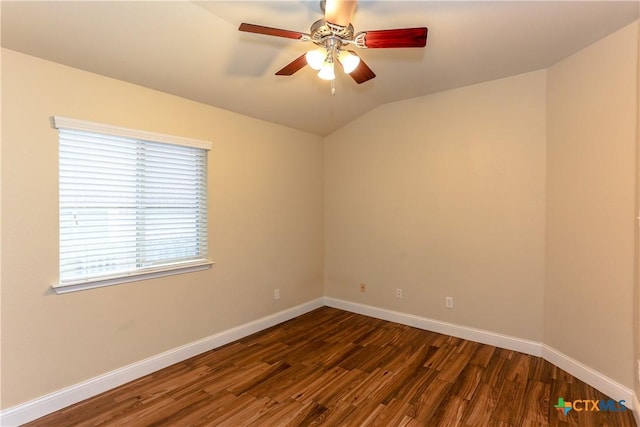 spare room with dark wood-type flooring, ceiling fan, and lofted ceiling