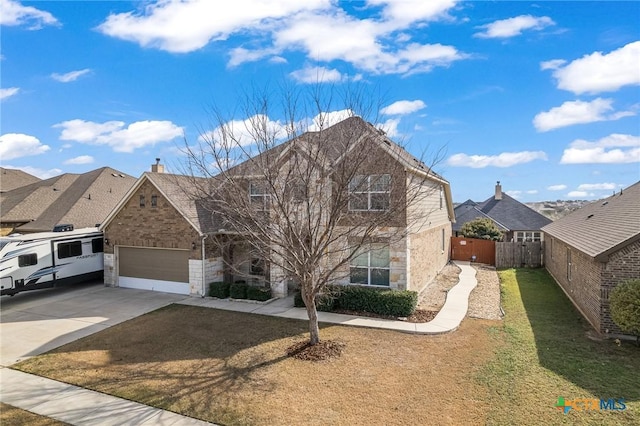 view of front of house with a garage and a front lawn