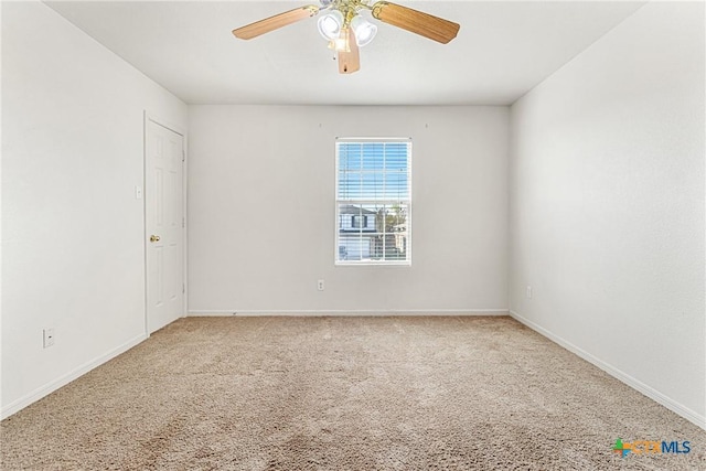 unfurnished room featuring ceiling fan and carpet floors