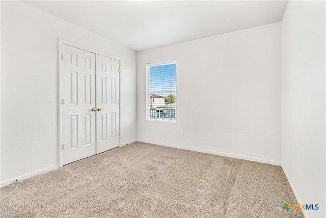 unfurnished room featuring carpet floors