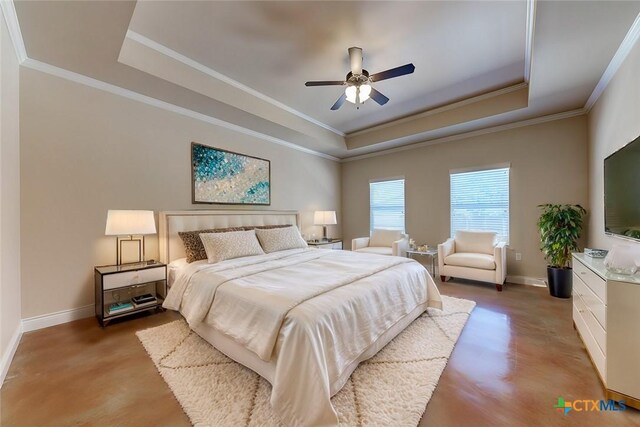 bedroom with ceiling fan, crown molding, a raised ceiling, and baseboards