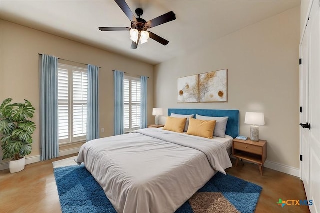 bedroom featuring light wood-style flooring, baseboards, and ceiling fan