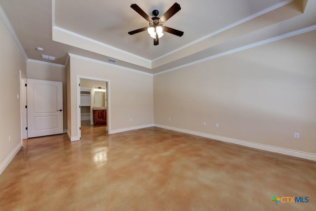 unfurnished bedroom with baseboards, a raised ceiling, and visible vents